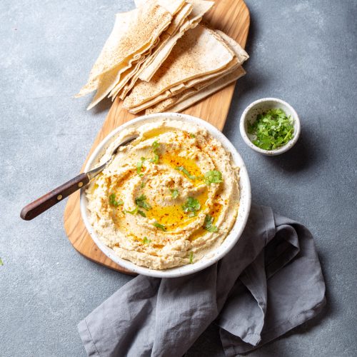 healthy homemade creamy hummus with olive oil and utc