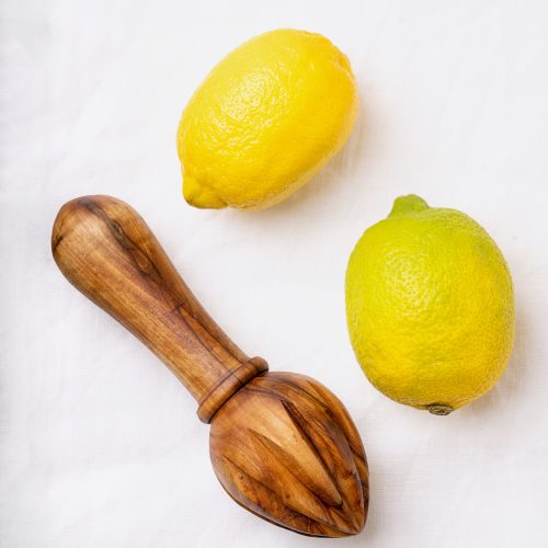 lemons with wooden juicer utc
